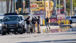 Heat waves ripple in the afternoon sun as investigators work the scene near the Route 91 Harvest country music festival, two days after a lone gunman opened fire onto the festival from the 32nd floor of the Mandalay Bay Hotel, killing 59 and wounding 527 people, on Tuesday, Oct. 3, 2017, in Las Vegas. Heat waves ripple in the afternoon sun as investigators work the scene near the Route 91 Harvest country music festival, two days after a lone gunman opened fire onto the festival from the 32nd floor of the Mandalay Bay Hotel, killing 59 and wounding 527 people, on Tuesday, Oct. 3, 2017, in Las Vegas.
