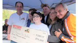 Joe Petrucelli (L), Owner of Tri-County Sporting Goods, presenting check for $70,000 to Joshua Brennan and his family (C) with Anthony Imperato (R), President of Henry Repeating Arms.