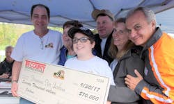 Joe Petrucelli (L), Owner of Tri-County Sporting Goods, presenting check for $70,000 to Joshua Brennan and his family (C) with Anthony Imperato (R), President of Henry Repeating Arms. Joe Petrucelli (L), Owner of Tri-County Sporting Goods, presenting check for $70,000 to Joshua Brennan and his family (C) with Anthony Imperato (R), President of Henry Repeating Arms.
