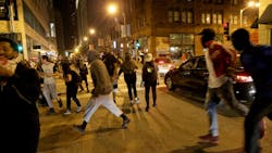Protesters run after violence broke out on downtown streets in University City, Mo., on September 17, 2017, in the third day of protests following the not guilty verdict of former St. Louis Police officer Jason Stockley in the shooting death of Anthony Lamar Smith. Protesters run after violence broke out on downtown streets in University City, Mo., on September 17, 2017, in the third day of protests following the not guilty verdict of former St. Louis Police officer Jason Stockley in the shooting death of Anthony Lamar Smith.