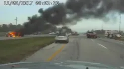 Newly released dashcam video shows a Ohio Highway Patrol trooper help pull a man to safety from a burning car just moments before it explodes.