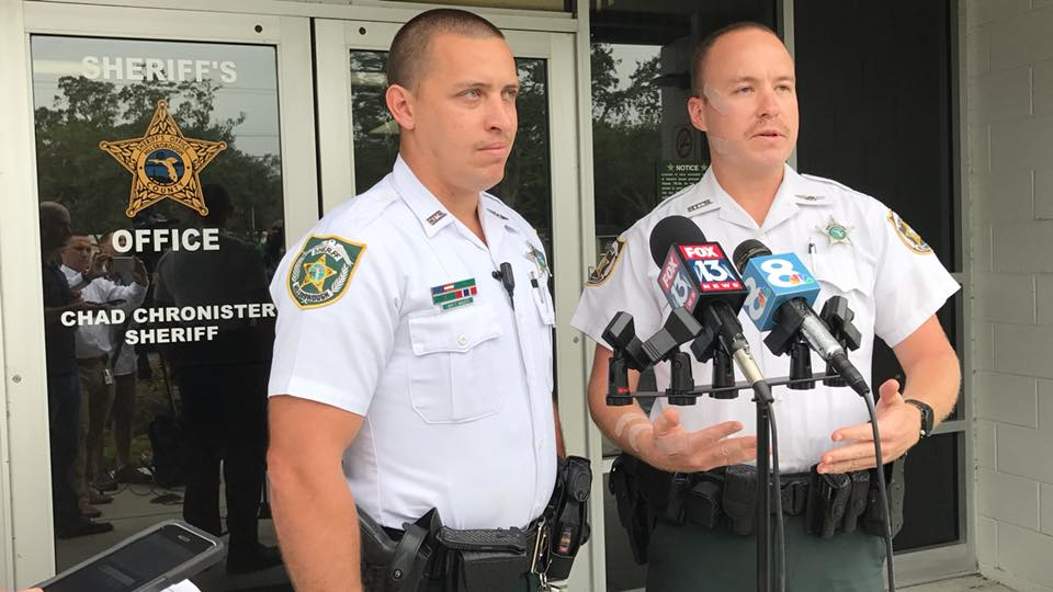 Hillsborough County Sheriff's Deputies Trent Migues, left, and Benjamin Thompson helped rescue 82-year-old Leona Evans after she crashed her SUV into a pond Saturday evening.