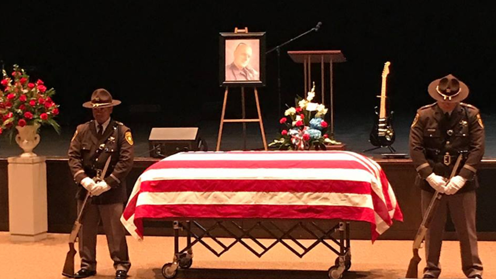Oakland County Sheriff's Deputy Eric Overall was remembered by friends and family at a funeral service Tuesday as someone who lived his mantra: 'Never quit.'
