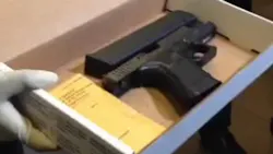 St. Louis police officials display a gun belonging to a suspect involved in an altercation with officers Tuesday. St. Louis police officials display a gun belonging to a suspect involved in an altercation with officers Tuesday.