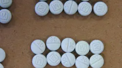 Three Lawrence police officers were exposed to the dangerous opioid fentanyl after a Summer Street mother told police her son and a friend were dealing drugs out of her apartment Monday night.