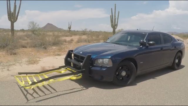 The Grappler vehicle accessory extends from a police vehicle bumper, throws a net around a tire of an eluding vehicle and stops it. A tether is connected to the patrol car. The first operational units shipped in January 2018.