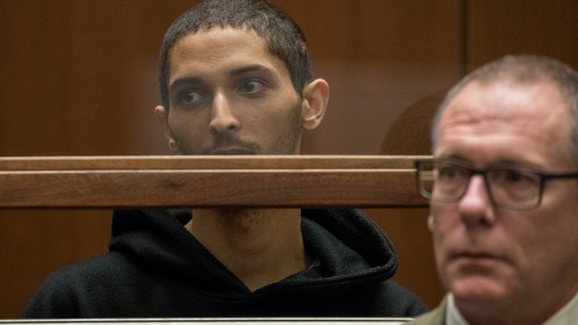 Tyler Raj Barriss, left, flanked by public defender, Mearl Lottman, appears for an extradition hearing at Los Angeles Criminal courts on Jan. 3, 2018, in Los Angeles. Barriss is accused of making a 'swatting' call that led to a man being fatally shot by police in Kansas.