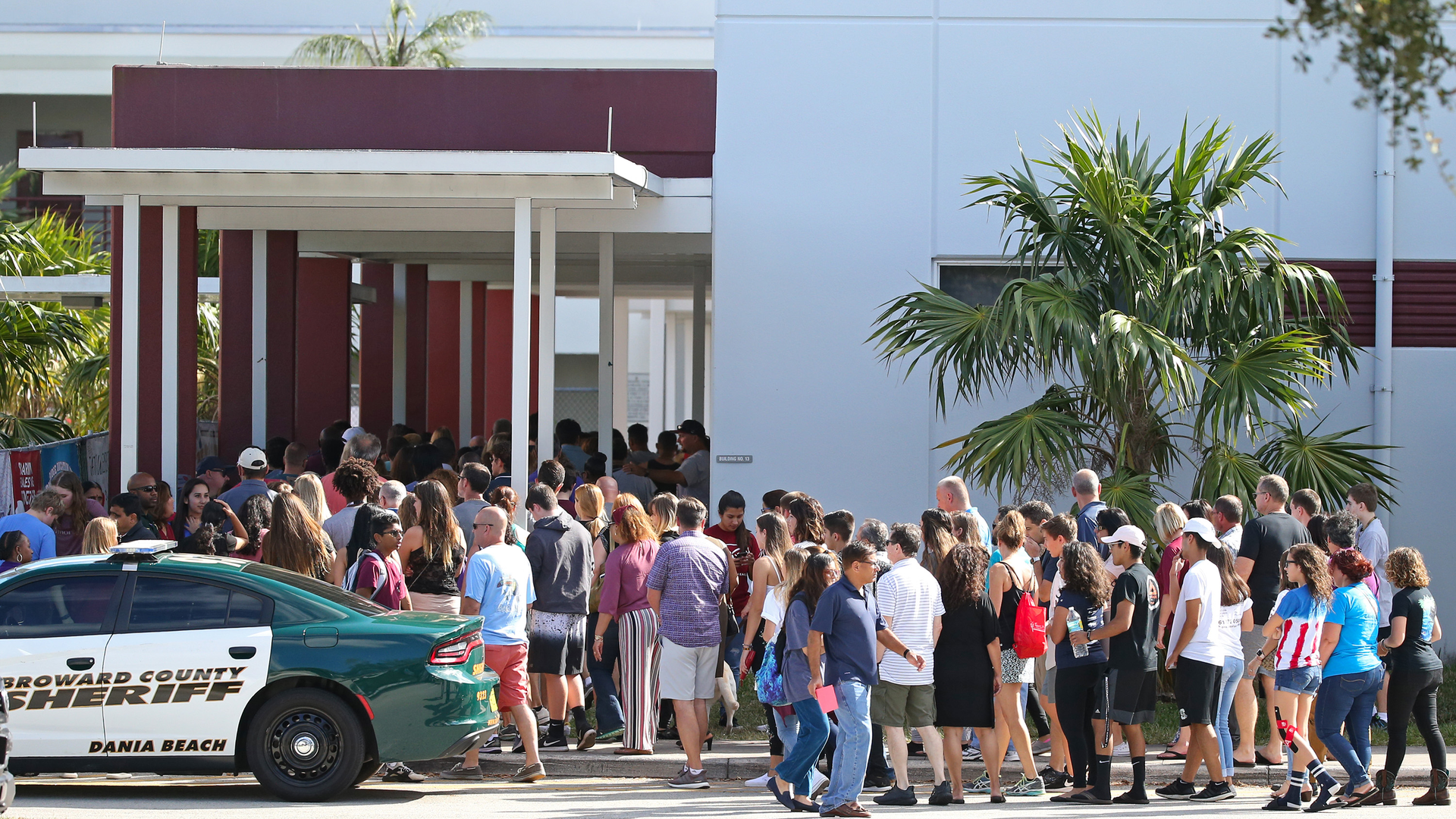 Parents and students walk into Marjory Stoneman Douglas High School on Sunday, February 25, 2018, for an open house as parents and students returned to the school for the first time since 17 people were killed in a mass shooting at the school in Parkland on February 14, 2018.