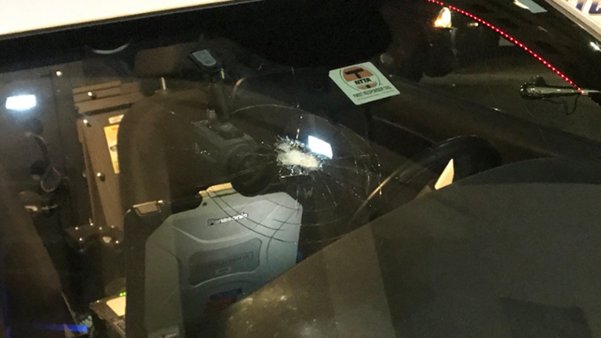 The Dallas Police Department launched a search Thursday for a suspect who opened fire on one of its patrol cars as an officer was driving.