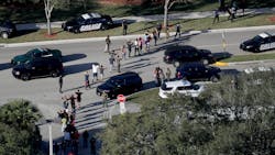 Students are evacuated by police out of Stoneman Douglas High School in Parkland, Fla., after a shooting on Wednesday, Feb. 14, 2018. Students are evacuated by police out of Stoneman Douglas High School in Parkland, Fla., after a shooting on Wednesday, Feb. 14, 2018.