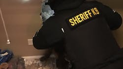 Deputies smash through a wall to apprehend Matthew T. Heidbrick on a warrant at his home on March 8.