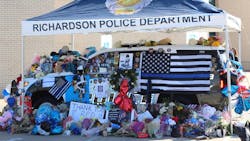 A makeshift memorial is seen outside the Richardson Police Department in honor of Officer David Sherrard, who was slain during an ambush at an apartment complex on Feb. 7.