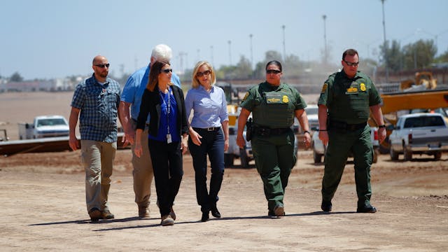 U.S. Department of Homeland Security Secretary Kirstjen M. Nielsen, middle, stops for a brief visit along the U.S.-Mexico border, where construction for the bollard fence is currently underway along the border in Calexico on Wednesday, April 18, 2018.