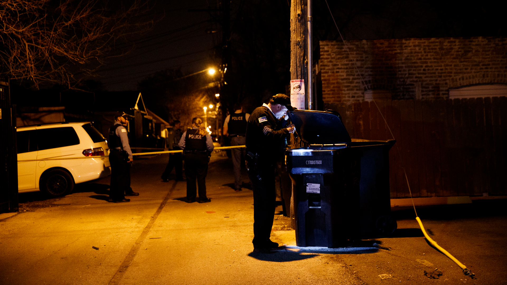 Police work the scene where two people were shot near the intersection of 60th and Maplewood Avenue Tuesday April 24, 2018 in Chicago.