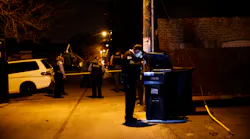 Police work the scene where two people were shot near the intersection of 60th and Maplewood Avenue Tuesday April 24, 2018 in Chicago.