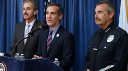 Los Angeles Mayor Eric Garcetti, center, flanked by Los Angeles City Attorney Mike Feuer, left, and LAPD Chief Charlie Beck, during a press conference detailing a court ruling against the Trump administration regarding its efforts to withhold federal grants from jurisdictions over their immigration enforcement policies on Thursday, April 12, 2018 at City Hall in Los Angeles, Calif.