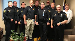 Seventeen weeks after being wounded in a shooting that claimed the life of one of his comrades, Douglas County Sheriff's Deputy Jeff Pelle, fourth from the left, is back on the job.