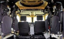 The interior of the Terrier LT-79 Tactical Vehicle by The Armored Group, looking toward the front.