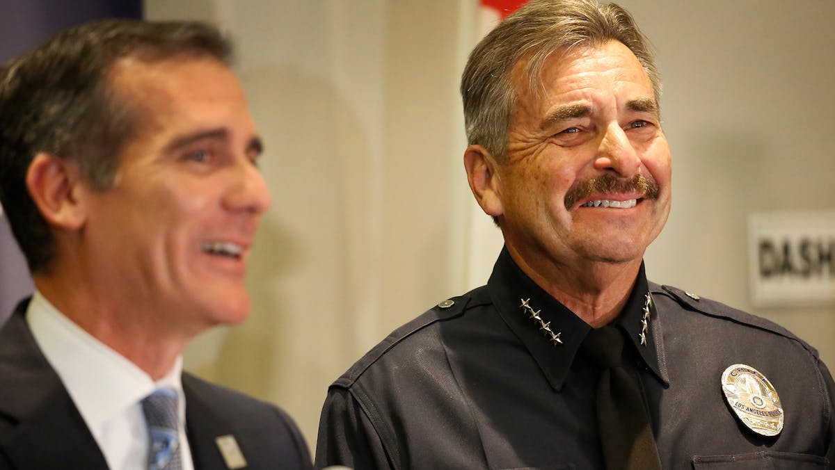 Los Angeles Police Department Chief Charlie Beck, right, and Mayor Eric Garcetti share smiles and a few tears at a news conference at LAPD headquarters on Friday, Jan. 19, 2018, as Chief Beck announced his upcoming retirement.
