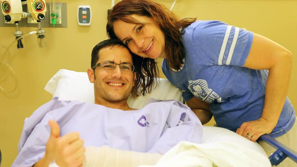 Minnesota State Patrol Sgt. Mike Krukowski is seen with his wife, Chrissy, at Hennepin County Medical Center in Minneapolis.