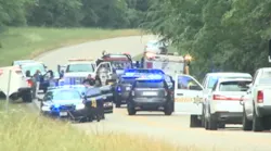 Raleigh Police Officer E.P. Morris' patrol car left the roadway and struck a tree before becoming engulfed in flames around noon Thursday on Highway 18.