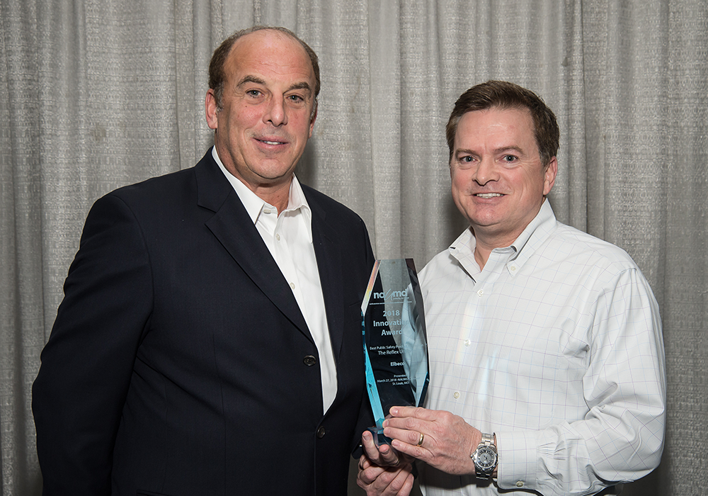 Elbeco&rsquo;s President & CEO, David Lurio (on left) and our Vice President of Sales and Marketing, David Burnette (right), receiving the award for Best Public Safety Product Innovation by the NAUMD during the 2018 expo.