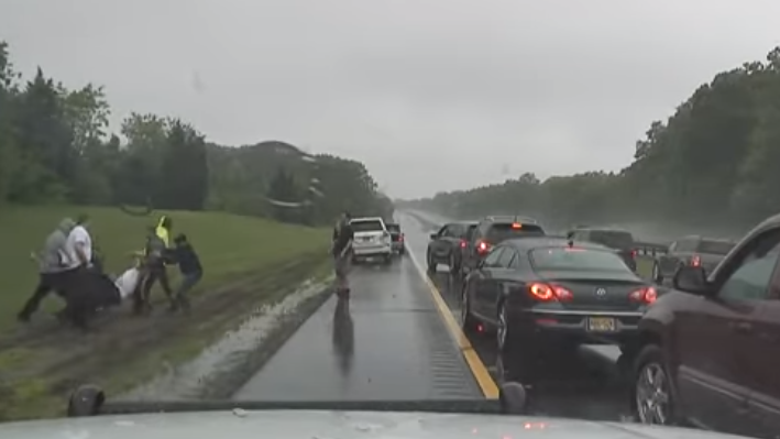 The New Jersey State Police has released dashboard camera video of Trooper Scott Behnke rescuing an unconscious man from a burning car late last month.