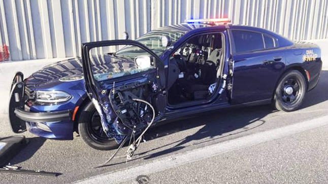The Nevada Highway Patrol says this car was pulled over Monday, Aug. 6, 2018, on a traffic stop when a passing car hit the door as a trooper was getting out.