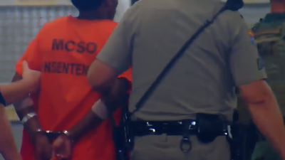 The suspected killer of an Arizona Department of Public Safety Trooper Tyler Edenhofer was released from the hospital and taken to jail after being placed in the fallen officer's handcuffs on Wednesday.