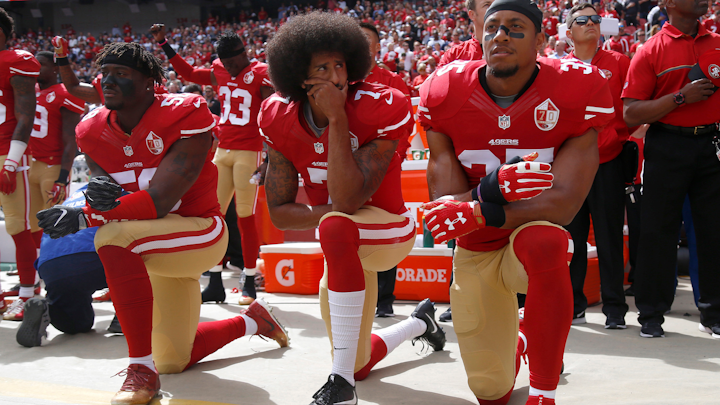 From left, The San Francisco 49ers' Eli Harold (58), Colin Kaepernick (7) and Eric Reid (35) kneel during the national anthem before their a game against the Dallas Cowboys on October 2, 2016, at Levi's Stadium in Santa Clara, Calif.