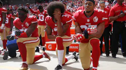 From left, The San Francisco 49ers' Eli Harold (58), Colin Kaepernick (7) and Eric Reid (35) kneel during the national anthem before their a game against the Dallas Cowboys on October 2, 2016, at Levi's Stadium in Santa Clara, Calif.