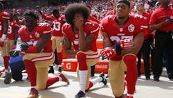 From left, The San Francisco 49ers&apos; Eli Harold (58), Colin Kaepernick (7) and Eric Reid (35) kneel during the national anthem before their a game against the Dallas Cowboys on October 2, 2016, at Levi&apos;s Stadium in Santa Clara, Calif.