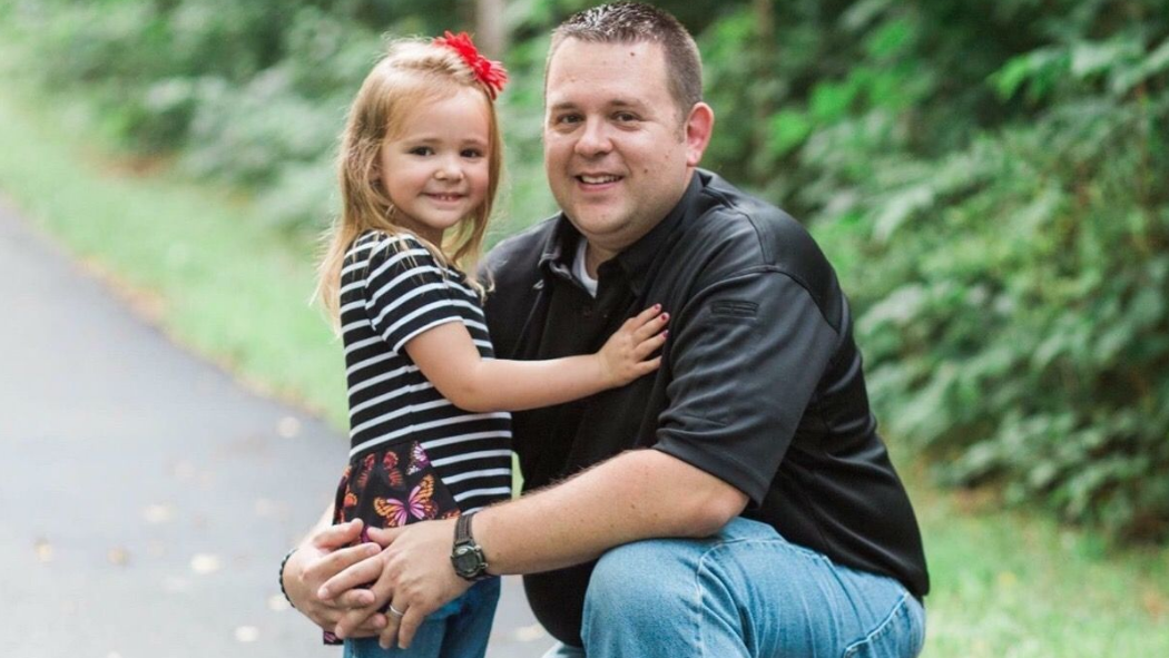 Deputy Aaron Paul Roberts is seen with his daughter.