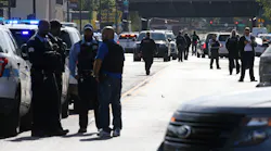 Police investigate the scene where six people were shot after a funeral service in the Burnside neighborhood on the South Side of Chicago on Monday afternoon, Oct. 22, 2018. The shooting took place in the 9200 block of South Cottage Grove Avenue. (Antonio Perez/Chicago Tribune/TNS)