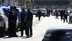 Police investigate the scene where six people were shot after a funeral service in the Burnside neighborhood on the South Side of Chicago on Monday afternoon, Oct. 22, 2018. The shooting took place in the 9200 block of South Cottage Grove Avenue. (Antonio Perez/Chicago Tribune/TNS) Police investigate the scene where six people were shot after a funeral service in the Burnside neighborhood on the South Side of Chicago on Monday afternoon, Oct. 22, 2018. The shooting took place in the 9200 block of South Cottage Grove Avenue. (Antonio Perez/Chicago Tribune/TNS)