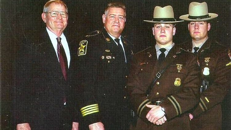LtCol. Ted Evans (ret), Sheriff Mike Evans, Trooper Charlie Evans and TFC Eric Evans. Photo circa 2007.