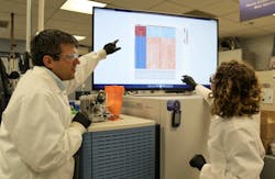 Trevor Glaros, Ph.D., and Elizabeth Dhummakupt, Ph.D., analyze data from a test of biomarkers found in blood to determine opioid exposure. Trevor Glaros, Ph.D., and Elizabeth Dhummakupt, Ph.D., analyze data from a test of biomarkers found in blood to determine opioid exposure.