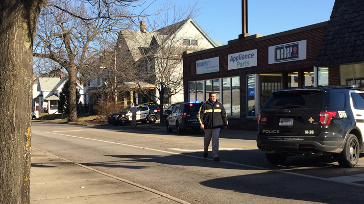 A Lafayette police officer was shot in the back by a colleague after a dog charged at the officers during an investigation Tuesday morning.