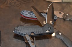 The Benchmade Outlast has 3 blades; an CPM-S30V drop point, a CPM-3V serrated blade with a squared off tip and 02 wrench, a 440 rescue hook, and a carbide tip glass breaker. The other blade that caught my eye was the one on which the Outlast is propped. This is the Freek in Deadpool colors. The Benchmade Outlast has 3 blades; an CPM-S30V drop point, a CPM-3V serrated blade with a squared off tip and 02 wrench, a 440 rescue hook, and a carbide tip glass breaker. The other blade that caught my eye was the one on which the Outlast is propped. This is the Freek in Deadpool colors.