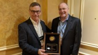 Pictured (left to right) Bruce Odle, acceptiong the Sales Rep Agency of the Year Award on behalf of Odle Sales from Ray Sharrah, Streamlight President and Chief Executive Officer.