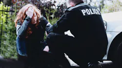 Officer And Distraught Woman