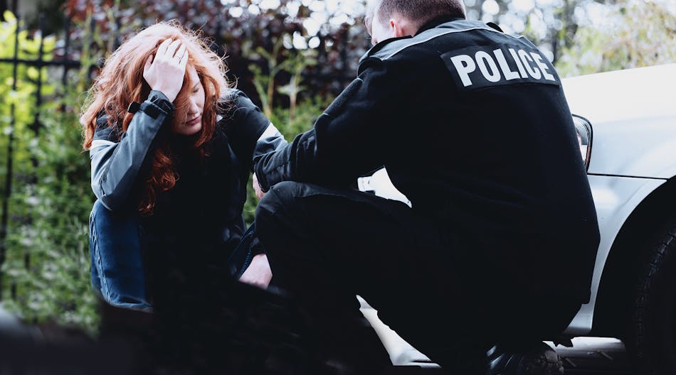 Officer And Distraught Woman
