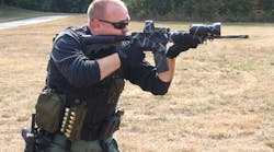 Frank Borelli firing a Rock River Arms AR-15.