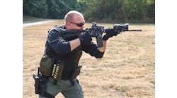 Frank Borelli firing a Rock River Arms AR-15.