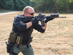 Frank Borelli firing a Rock River Arms AR-15. Frank Borelli firing a Rock River Arms AR-15.