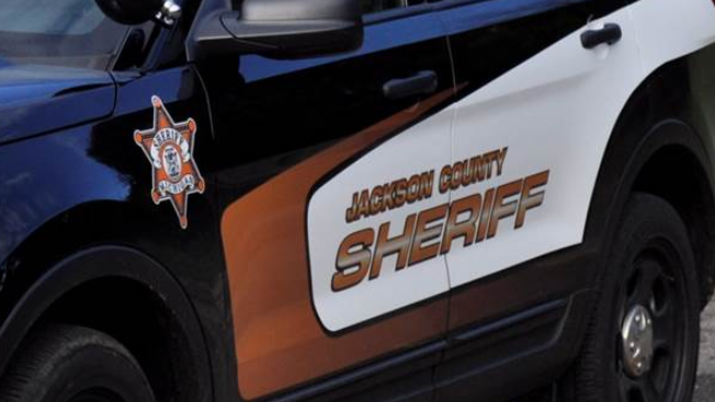 A Jackson County Sheriff's deputy responded to reports of a domestic pursuit was shot multiple times and a suspect was fatally wounded Wednesday night.