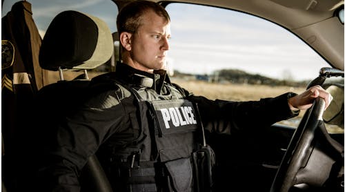 Properly fit body armor has to provide maximum coverage but also take into consideration the amount of time officers spend sitting in their patrol vehicle. Seen here is Hard Core PT overt/outer carrier from Armor Express.