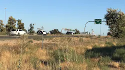 Police are seen near the Eastridge Avenue exit of the 215 Freeway where a wild shootout occurred on Monday, Aug. 12, 2019.