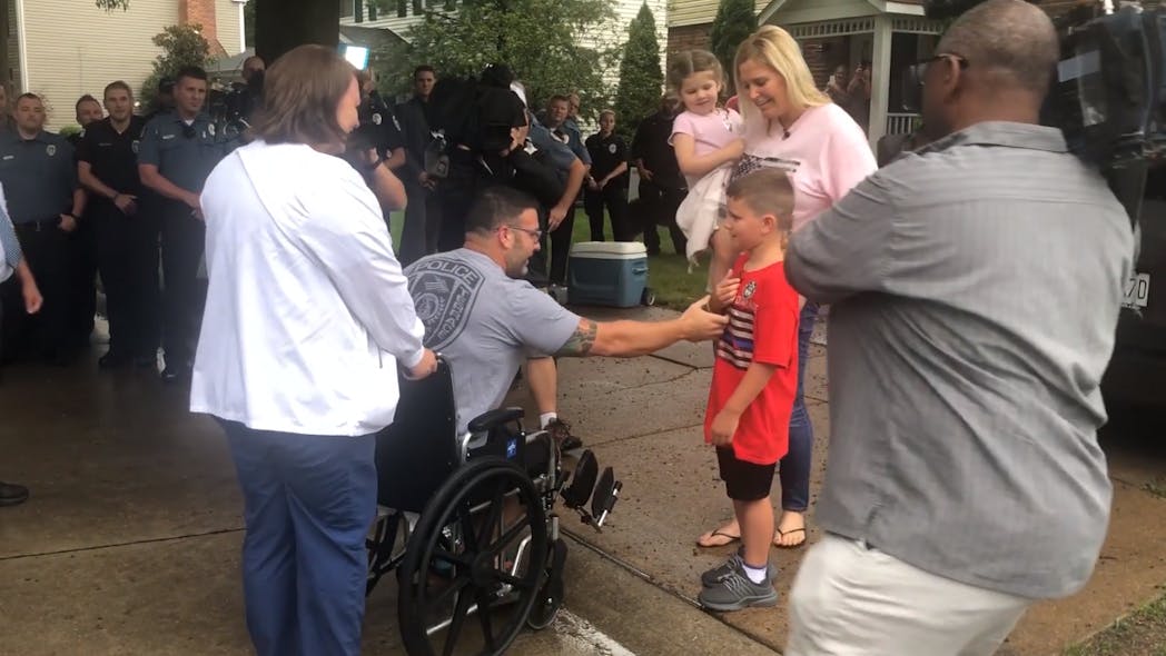 St. Louis County Police Officer Andy Mattaline, who was recently diagnosed with cancer and underwent a serious surgery two weeks ago, left the hospital and was joined by his colleges to escort his autistic son to the first day of school Monday morning.