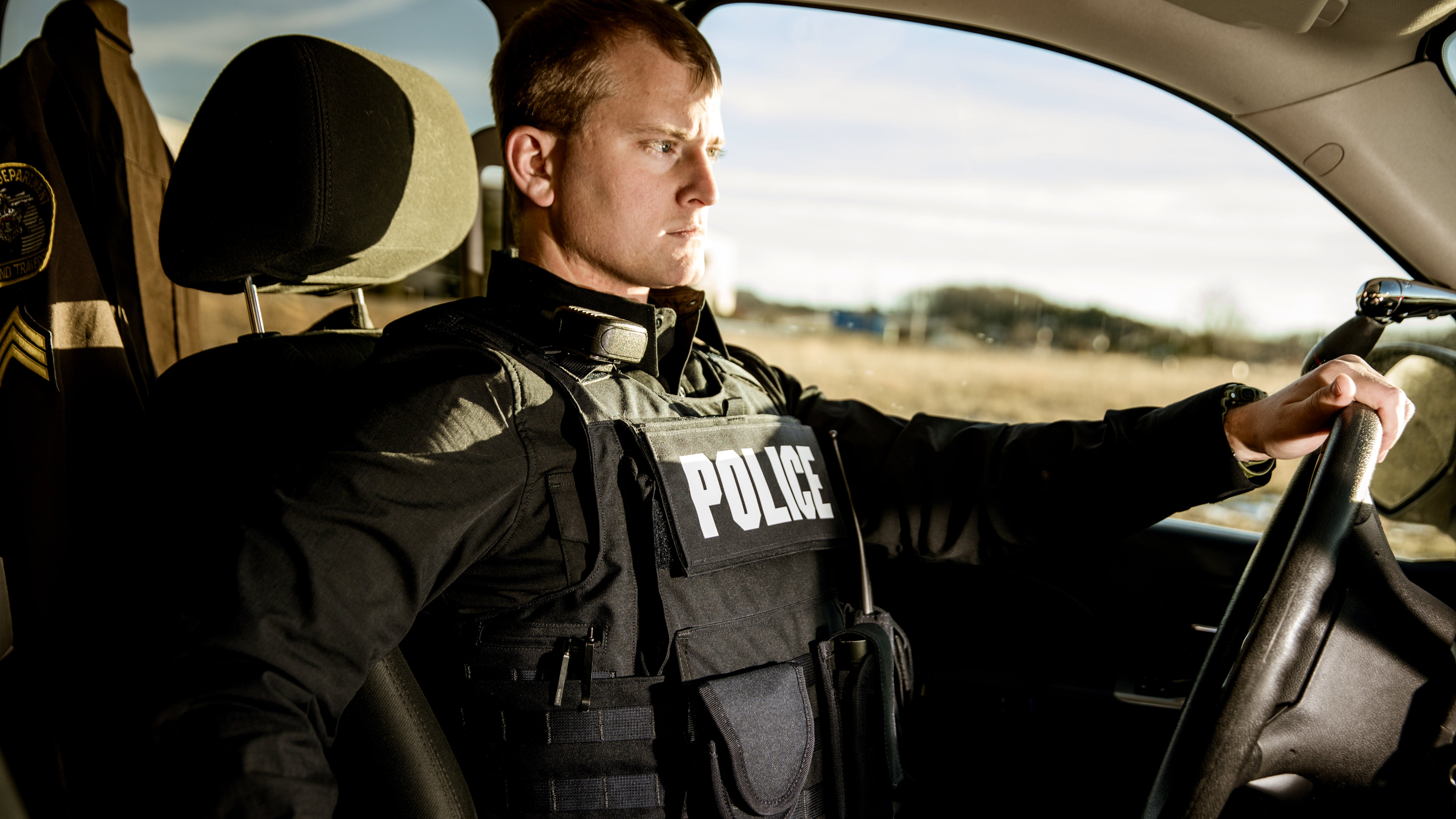 Properly fit body armor has to provide maximum coverage but also take into consideration the amount of time officers spend sitting in their patrol vehicle. Seen here is Hard Core PT overt/outer carrier from Armor Express.